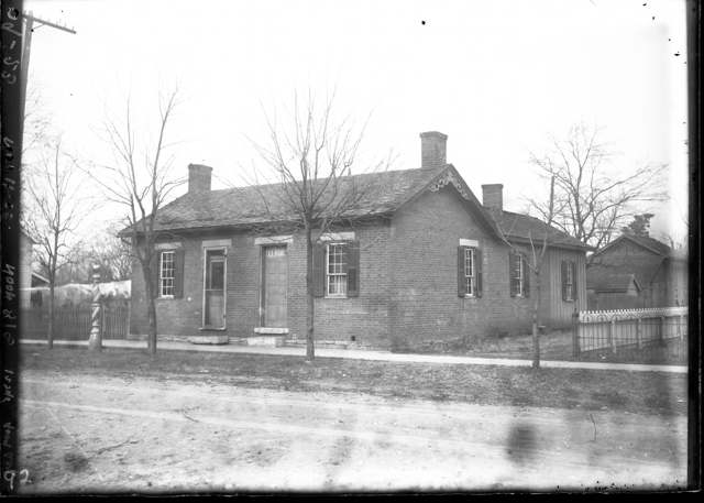 A barber shop on State Road in Amanda, with the Baptist Church visible at Forrer and Mulberry streets, by the railroad tracks
