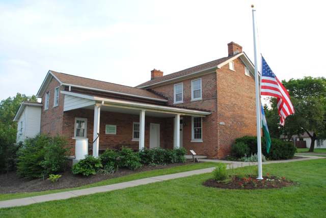 The Gantz Homestead and garden, the 1832 brick farmhouse of Adam Gantz, now in Gantz Park.