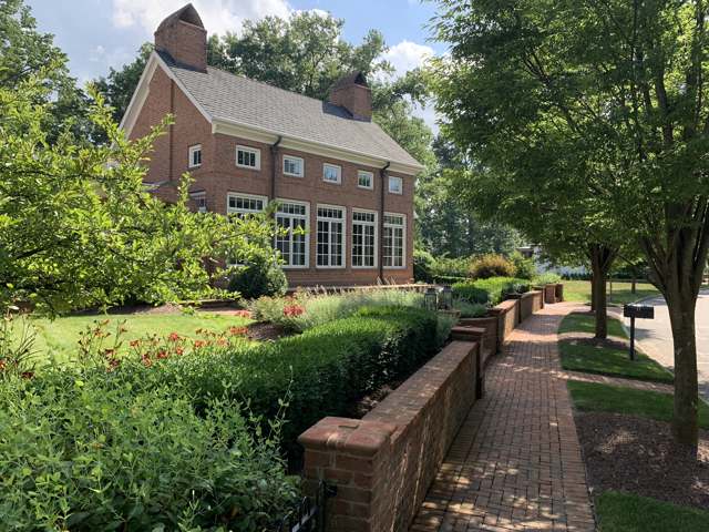 A red brick Georgian-style home in the Early Crossing neighborhood, illustrating the architectural style New Albany has required of new development since its 1990s remaking; photographed 2019.