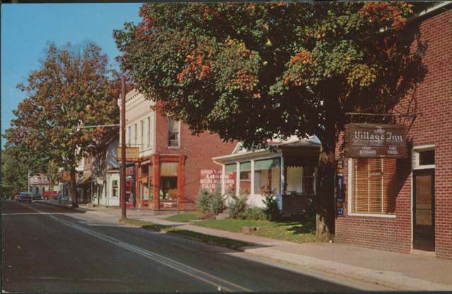 Color postcard view of Main Street, Utica