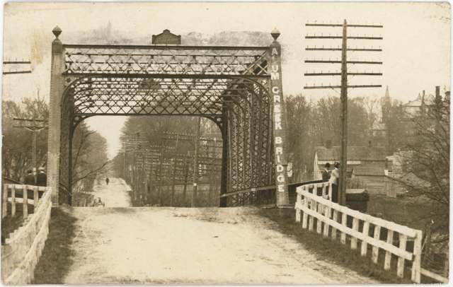 Postcard view of a bridge over Alum Creek at Westerville, postmarked June 23, 1914.
