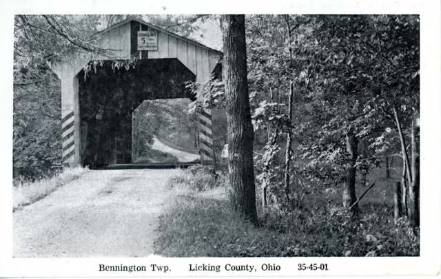 Black-and-white postcard view of the Belle Hall covered bridge over the Otter Fork in Bennington Township
