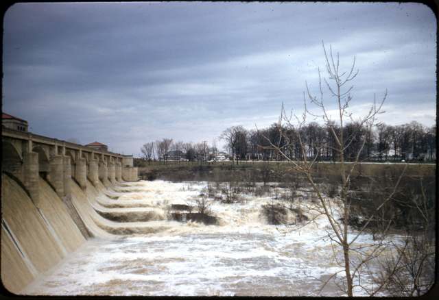 Water spilling over O'Shaughnessy Dam during the 1957 flood