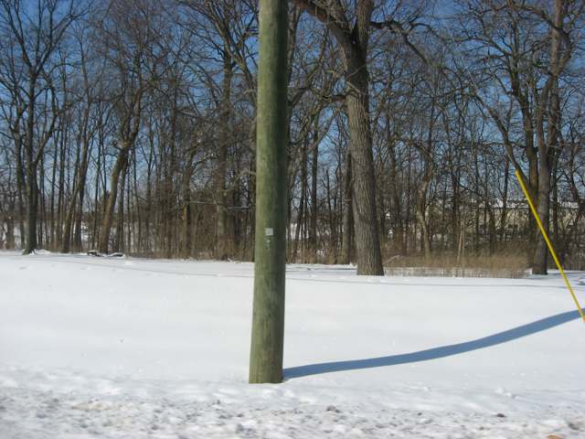 The vacant, snow-covered lot on Hayden Run Road where the Frantz House (built 1870, NRHP-listed as the E. Boles Cottage in 1979) once stood before its demolition.