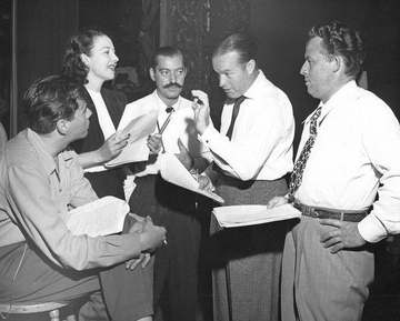 Photo of Bob Hope, Jerry Colonna, Dezi Arnaz, Sr., Frances Langford and unidentified man. The photo appears to be a rehe