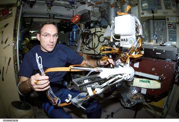 Astronaut Carl E. Walz, Expedition Four flight engineer, works with the Amateur Radio (HAM) WA3 Antenna Assembly in the 