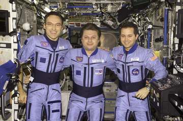 The Expedition Four crewmembers pose for an informal crew photo in the Destiny laboratory on the International Space Sta