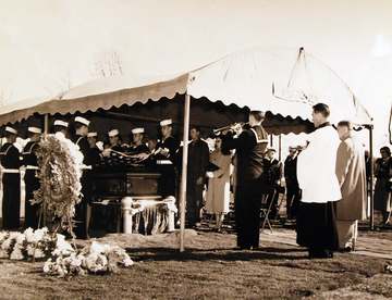 330-PS-844 (USN 707992): U.S. Navy’s First Arlington Burial of Korean Casualty. A bugler blows taps at the first funeral