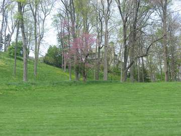 View through the trees of the rebuilt Charles F. Kettering House, located off Southern Boulevard in Kettering, Ohio, Uni