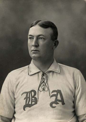 Denton True "Cy" Young, head-and-shoulders portrait, facing left, wearing Boston Americans baseball team uniform.