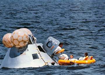 The prime crew of the first manned Apollo mission (Spacecraft 101/Saturn 205) participates in water egress training in t