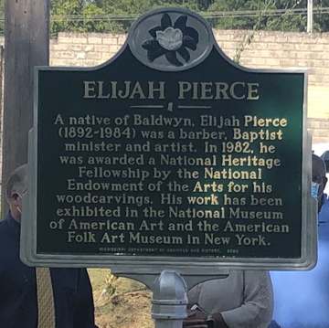 Artist Elijah Pierce Historic Marker in his hometown Baldwyn, Mississippi. The sign is located in the southeast corner o