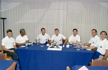 STS039-S-051 (28 April 1991) --- In KSC's Operations and Checkout Building, a very light breakfast is shared by the seve