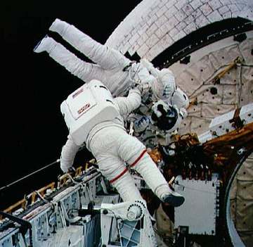 Astronauts Gregory Harbaugh and Mario Runco, Jr. during the EVA on STS-54. STS-54 Mission Specialist (MS2) and extravehi