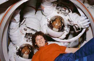 STS-54 Mission Specialist Greg Harbaugh (red stripe) and Mission Specialist Mario Runco, both wearing their space suits,