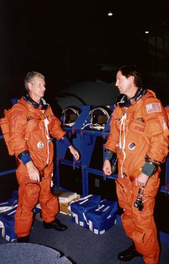Steven A. Hawley (left) and Gregory J. Harbaugh participate in a training session in JSC's systems integration facility.