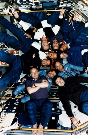 Inside the Spacelab Science Module, the crewmembers of STS-71, Mir- 18, and Mir-19 pose for the traditional inflight pic