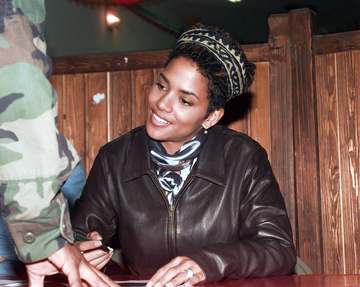 Actress Halley Berry signs autographs for US soldiers at Tuzla Main Base, Bosnia-Herzegovina, during Operation JOINT GUA