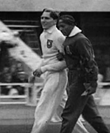 The photo shows Luz Long walking arm in arm with Jesse Owens through the Berlin Olympic Stadium following the long jump 