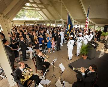 Members of the U.S. Navy Ceremonial Guard from Washington, DC present the Colors during a memorial service celebrating t
