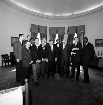 Members of the National Basketball Association (NBA) Boston Celtics team visit with President John F. Kennedy in the Ova
