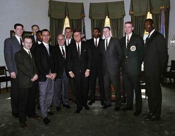 Members of the National Basketball Association (NBA) Boston Celtics team visit with President John F. Kennedy in the Ova