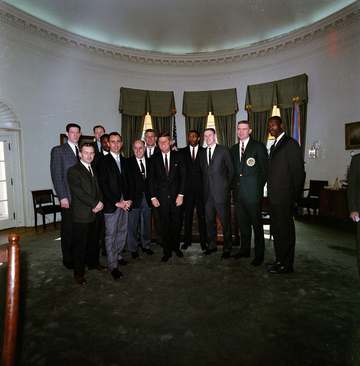 Members of the National Basketball Association (NBA) Boston Celtics team visit with President John F. Kennedy in the Ova