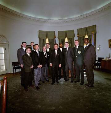 Members of the National Basketball Association (NBA) Boston Celtics team visit with President John F. Kennedy in the Ova
