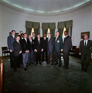 Members of the National Basketball Association (NBA) Boston Celtics team visit with President John F. Kennedy in the Ova