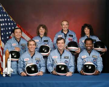 The crew of Space Shuttle mission STS-51-L pose for their official portrait on November 15, 1985. In the back row from l