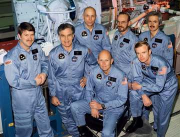 The crew assigned to the STS-51F mission included (kneeling left to right) Gordon Fullerton, commander; and Roy D. Bridg