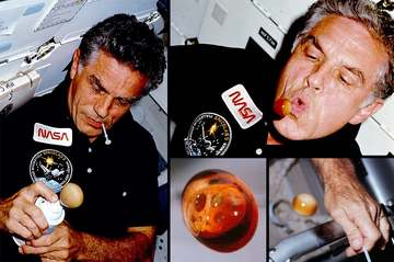 Karl Henize, STS-51F mission specialist, creates frothy, fizzing Pepsi soda balls during the Carbonated Beverage Dispens