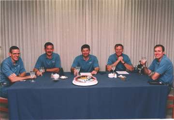 Hopeful that today will bring better conditions for launch, the STS-74 astronauts get ready for an early morning lunch i