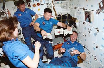 Mission Specialist (MS) Linda M. Godwin, Mission Commander Steven R. Nagel and Mission Specialist Jerry L. Ross watching