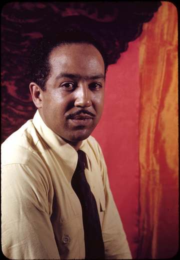 Kodachrome photo of Langston Hughes taken by Carl Van Vechten. Since his photos are in the public domain and the Van Vec