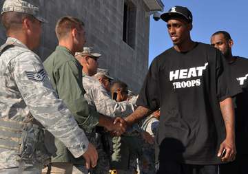 The Miami Heat's Anthony Mason Jr. and fellow teammates meet Airman from the 96th Ground Combat Training Squadron follow