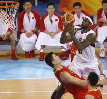 U.S. Olympic Men's Basketball team member LeBron James goes up for shot against China's Yao Ming Sunday, Aug. 10, 2008, 