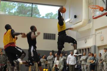 LeBron James, a forward with the National Basketball Association team the Miami Heat, dunks a basketball after driving p