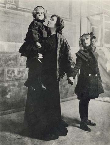 Mary Robinson McConnell (Mary Gish) carries her daughter Dorothy Gish and holds her older daughter Lillian Gish by the h