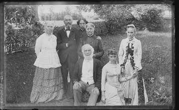 Title: Group portrait of members of the Blackwell and Spofford families outside on a lawn. Photograph probably shows (ba