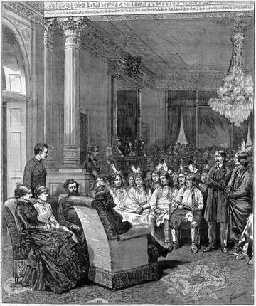 Rutherford B. Hayes and Carl Schurz, along with Mrs. Hayes with a lady friend, sit opposite a group of representatives f