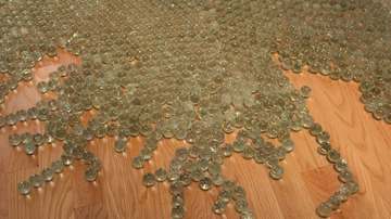 Maya Lin installation at Renwick Gallery, marbles arranged together to symbolize a map of the Chesapeake Bay
