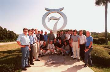 At Cape Canaveral Air Station, members of the 1998 astronaut candidate class (Group 17) pose in front of the Project Mer