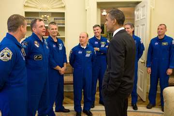 President Barack Obama greets crew members from the Space Shuttle Atlantis and the International Space Station in the Ov