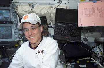 Astronaut Nancy J. Currie, mission specialist, remains near the controls (upper left) for Columbia's Remote Manipulator