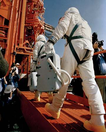 KSC-66C-1861 Gemini-8 Astronauts Neil Armstrong and David Scott are shown entering elevator at Complex 19, Cape Kennedy.