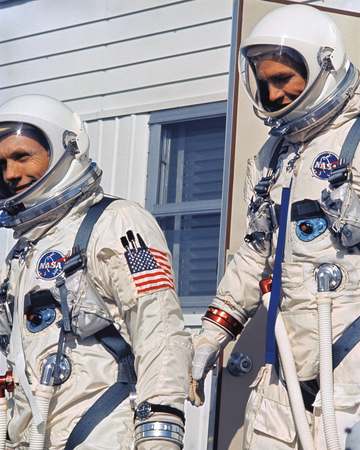 KSC-66C-1851 Astronauts Neil Armstrong and David Scott leave Suiting Trailer to enter Transfer Van, Complex 19, Cape Ken