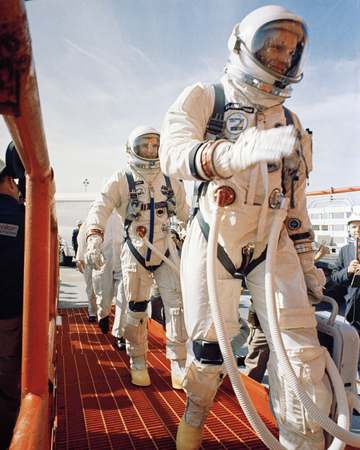 KSC-66C-1863 Gemini-8 Astronauts Neil Armstrong and David Scott prepare to enter elevator at Complex 19, Cape Kennedy. (