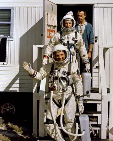 KSC-66C-1869 Astronauts Neil Armstrong and David Scott leave Suiting Trailer and enter Transfer Van at Cape Kennedy prio