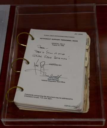 Pamela Melroy's Astronaut Support Personnel Book signed by Neil Armstrong. This photo was taken in the restoration secti